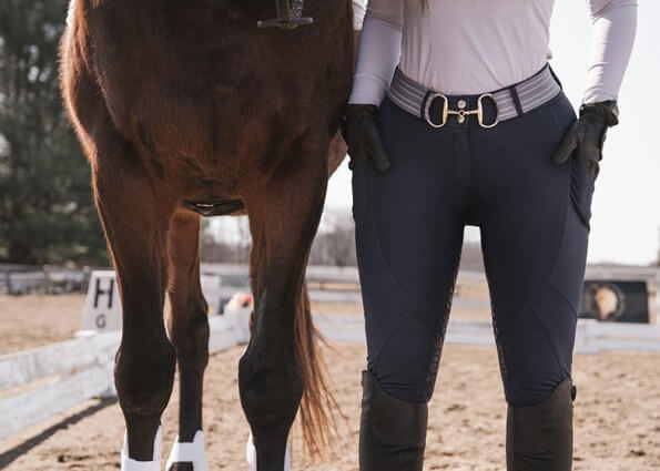 close up of horse and rider legs