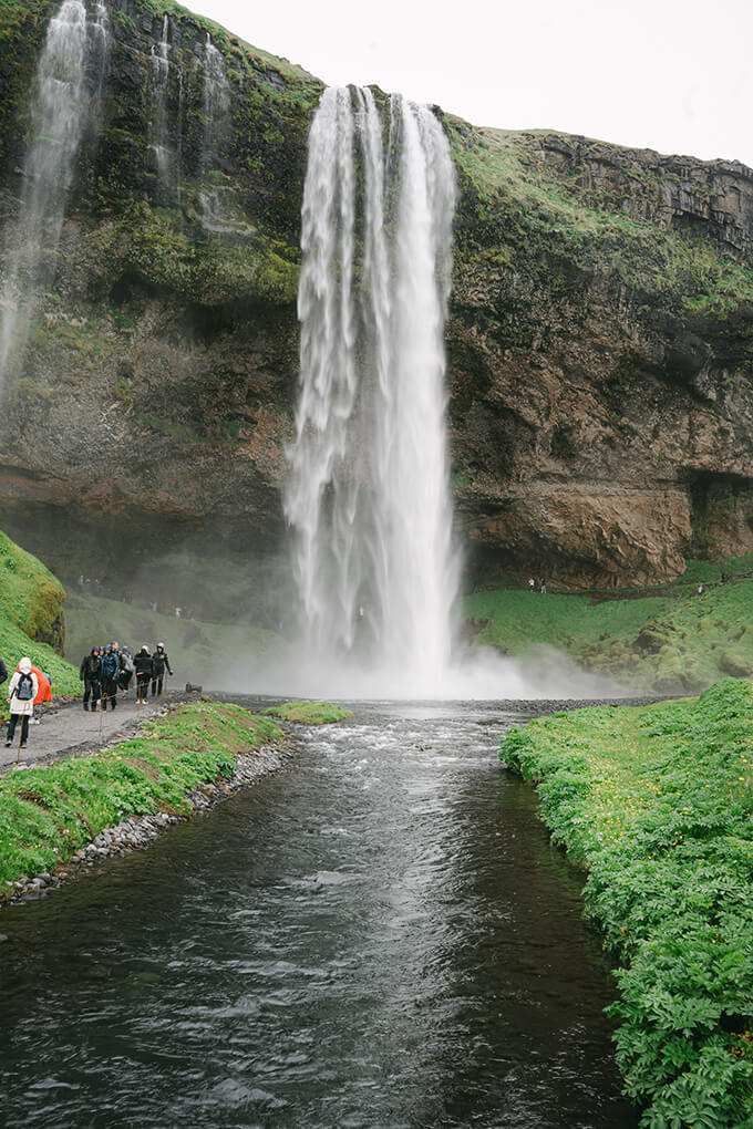 view of Seljalandsfoss waterfall with the river