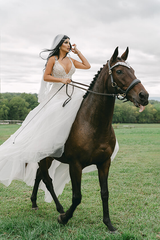 bride riding her horse to the ceremony