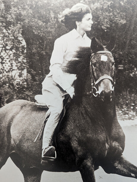 black and white image of Jackie Kennedy riding in Pakistan