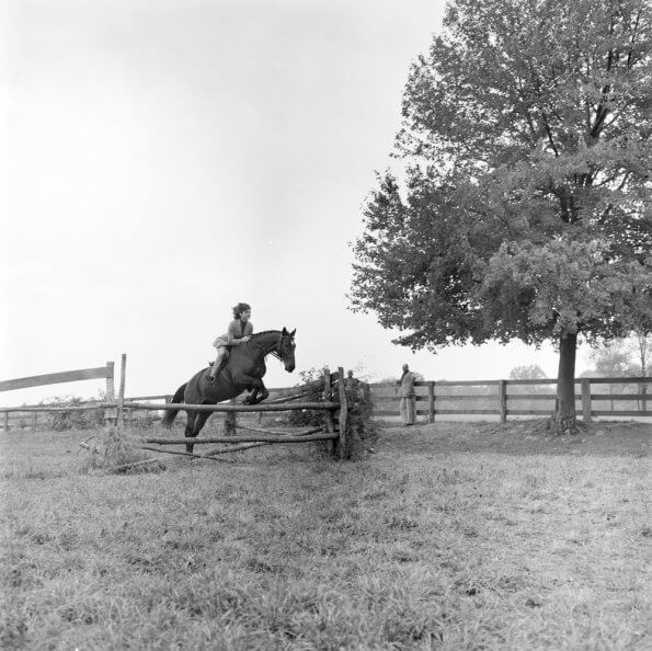 Jackie Kennedy jumping her horse Sardar at Glen Ora