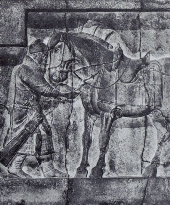 photo of stone carving of Ferghana horse with person