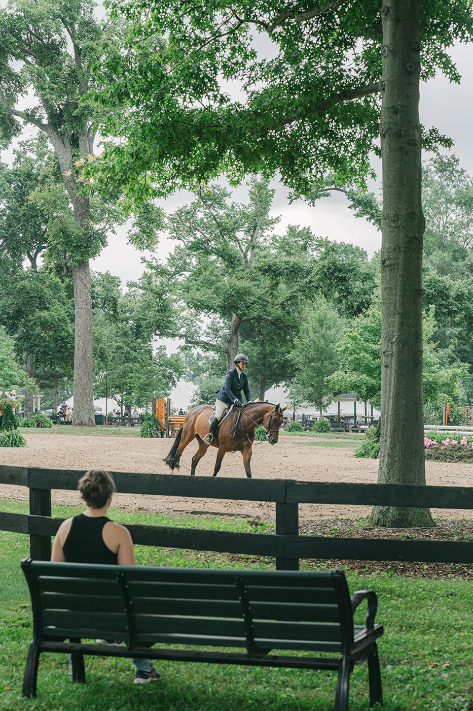 the main hunter ring at Upperville Horse Show with person watching